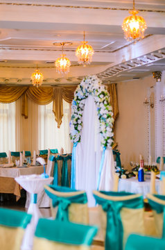 Wedding decor .Arch for carrying out of painting . beautiful wedding feather