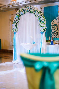 Wedding decor .Arch for carrying out of painting . beautiful wedding feather