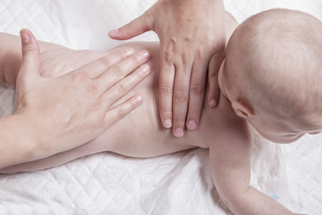 Fototapeta na wymiar Three month baby boy back massage