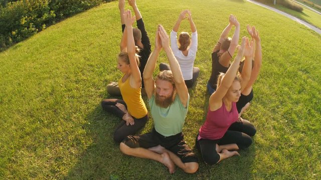 Young people do yoga at nature