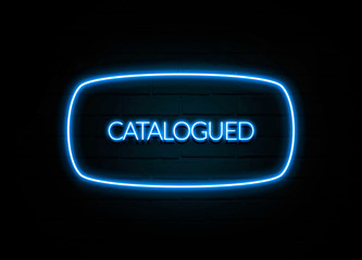 Catalogued  - colorful Neon Sign on brickwall