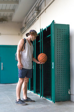 Man with orange ball in changing room
