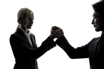 Silhouette of businessman and businesswoman. Business partnership concept.