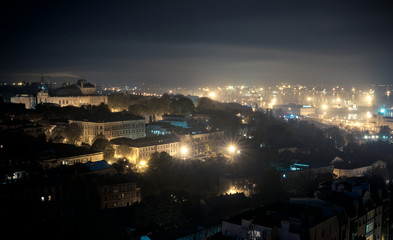 Fototapeta na wymiar aerial view of Odessa , Ukraine. Roofs, port and sea at night