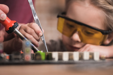 Preschooler child learning to braze