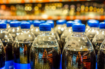 Many bottles with pepsi top view. background made by big pepsi bottles