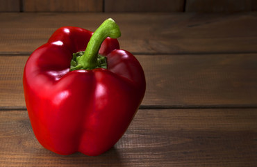 Bell peppers on the wooden background