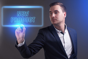 The concept of business, technology, the Internet and the network. Young businessman showing inscription: New product