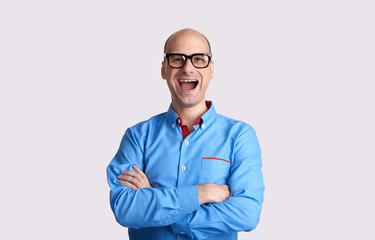 Happy bald man wearing glasses. Isolated