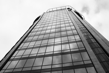 Fototapeta premium Modern building. Modern office building with facade of glass.