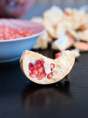 Half of pomegranate on table close up