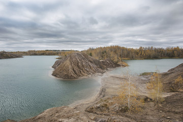 Turquoise quarry at Romantsevo (village Konduki). Tula region, Russia. Autumn landscape
