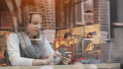 Portrait of female chatting online on smartphone
