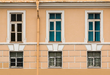Several windows in a row on facade of urban office building front view, St. Petersburg, Russia
