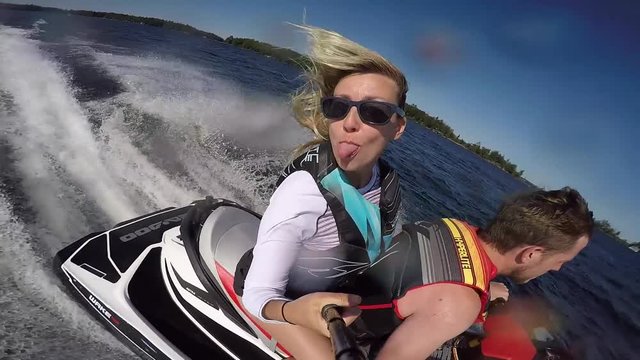 girl on seadoo sticks her tongue out cute and funny selfie