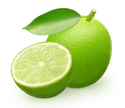 Whole fresh lime fruit with green leaf and half