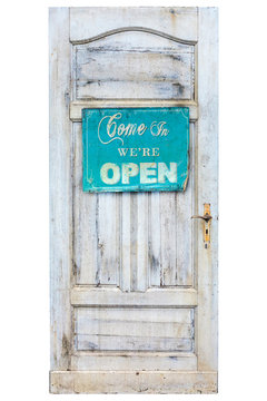 Weathered wooden door with welcome sign