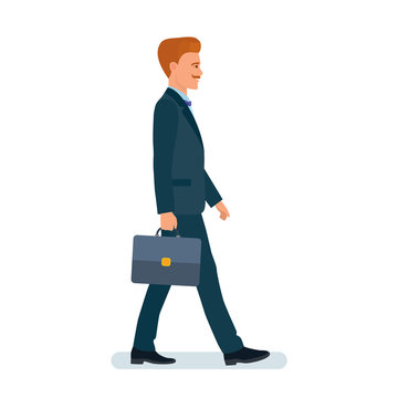 Man, businessman, in business suit, goes with briefcase in hand.