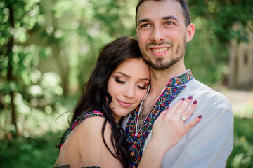 Obraz premium Pretty lady with dark hair leans to a handsome man