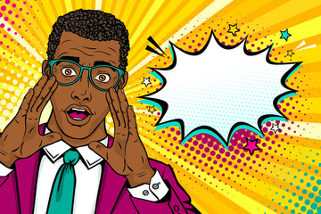 Wow male face. Young surprised afro american man in suit and glasses with open mouth and rising hands screaming announcement and empty speech bubble. Vector background in comic retro pop art style.  - obrazy, fototapety, plakaty