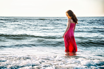 Fototapeta na wymiar Woman standing on the sea