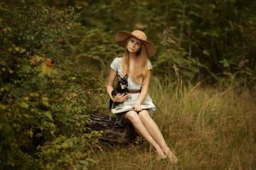 The lady in the hat and the dog