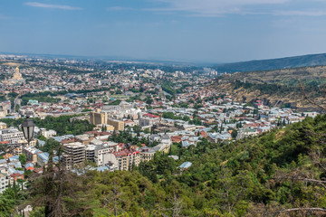 Fototapeta na wymiar Tbilisi, Georgia, Europe - City view from Mtatsminda Park at the top of the Funicular Railway.