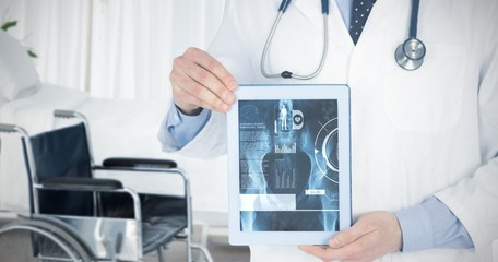 Fototapeta na wymiar Composite image of doctor showing a digital tablet