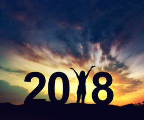 Silhouette young woman Enjoying on the hill and 2018 years while celebrating new year