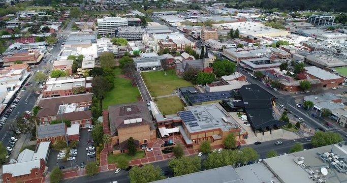 Rooftops of regional NSW town Albury at Victoria border – downtown with town hall, church and historic buildings in aerial view.
