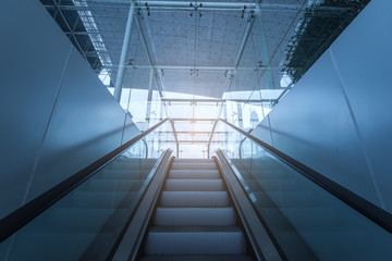 Fototapeta na wymiar stairway of modern office building, blue toned images.