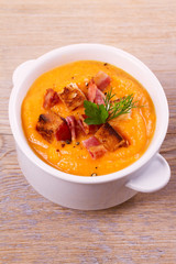 Butternut Squash and Bacon Soup in White Bowl, vertical