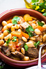 Beef stew with beans and vegetables.