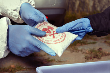 Police staff stock to container drugs found in car under the bridge - obrazy, fototapety, plakaty