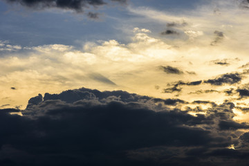Cloudy sky group with condensation in evening before sunset and raining.
