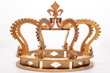 close-up of golden royal crown on white background