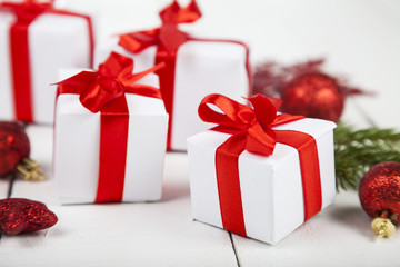 Gifts with red bows and Christmas decorations