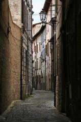 Dark street in Recanati downtown, Marche, italy
