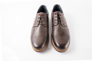 Male brown leather shoes on white background, isolated product, comfortable footwear.