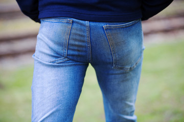 closeup of man’s butt in dirty jeans
