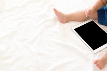 Cute baby with a tablet, copy space image