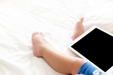 Cute baby with a tablet, copy space image