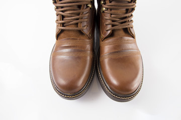 Male brown leather boot on white background, isolated product.