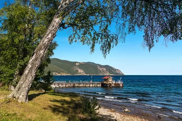 Zelfklevend Fotobehang The pier in the Bolshie Koty village on the shore of Lake Baikal © tilpich