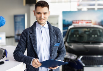 salesman about new car in dealership