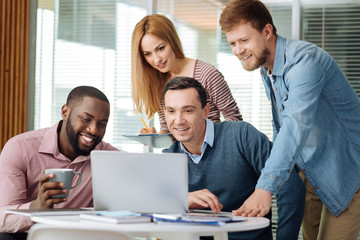 Concentrated people watching news on computer