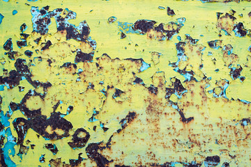 peeling paint on a metal fence