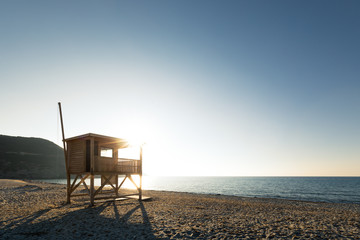 Evening sun on lifeguard tower on Ostriconi beach in Corsica