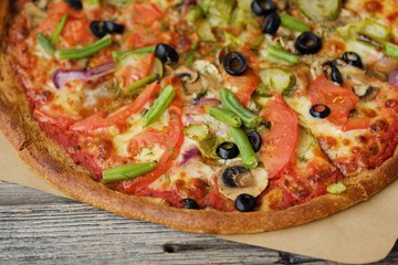 Delicious vegetarian pizza on a rye dough with vegetables 