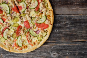 Delicious pizza with chicken cheese and vegetables